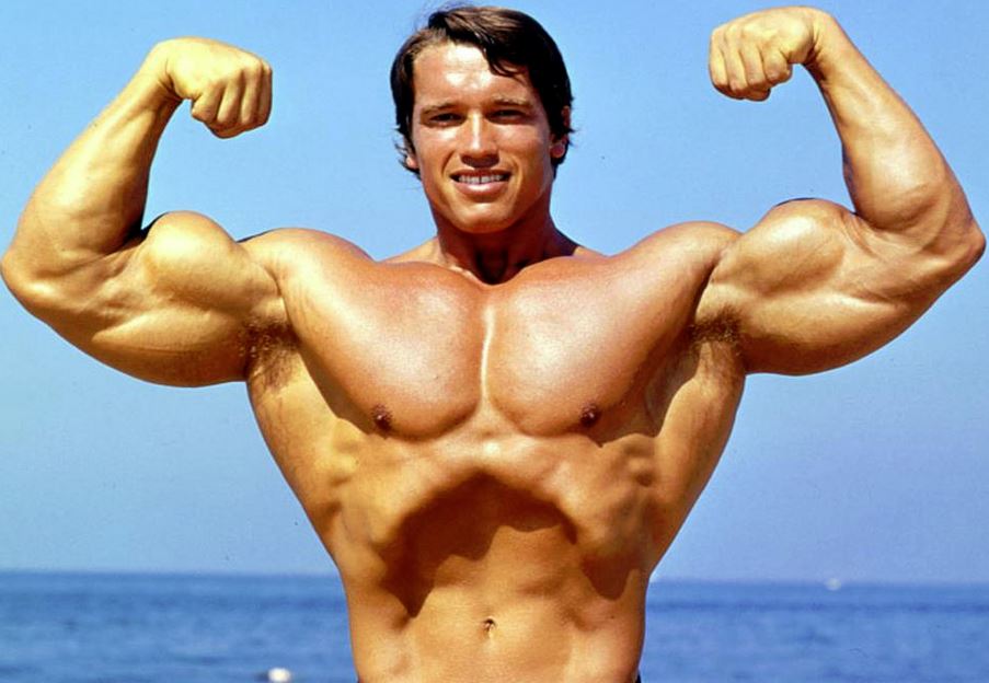 Arnold-flexing - Generation Iron Fitness & Bodybuilding 