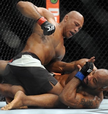 December 12, 2015; Las Vegas, NV, USA; Ronaldo Souza lands punches  against Yoel Romero during UFC 194 at MGM Grand Garden Arena. Mandatory Credit: Gary A. Vasquez-USA TODAY Sports