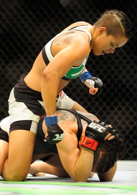 Aug 8, 2015; Nashville, TN, USA; Sara McMann (red gloves) fights against Amanda Nunes (blue gloves) during UFC Fight Night at Bridgestone Arena. Mandatory Credit: Joshua Lindsey-USA TODAY Sports ORG XMIT: USATSI-230410 ORIG FILE ID:  20150808_gma_bl6_395.jpg