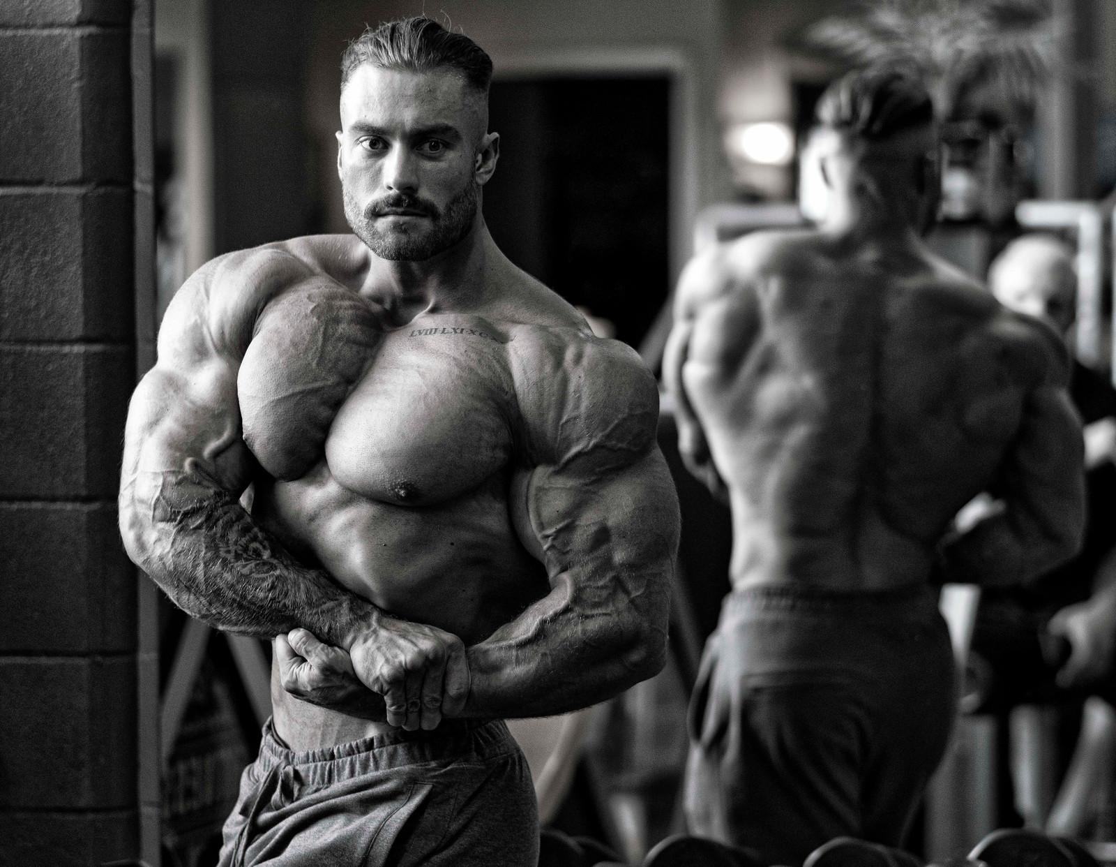 Download Chris Bumstead Double Front Bicep Pose Wallpaper