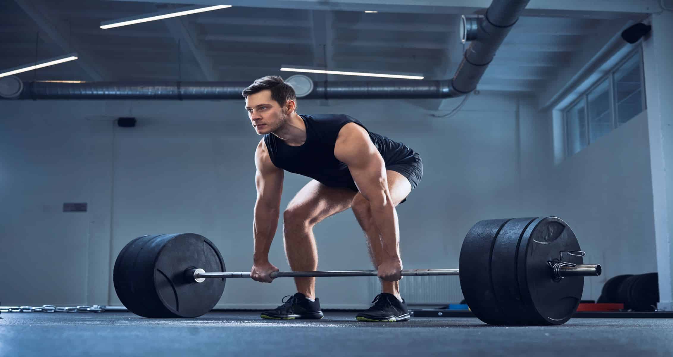 man-doing-barbell-exercise-at-gym-during-weight-li-2022-03-08-01-03-53-utc.jpg